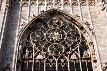 italy church  rose window  the front of the duomo  in milan and column
