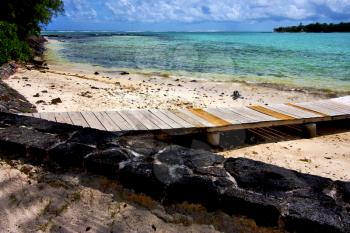  pier blue bay foam footstep indian ocean some stone in the island of deus cocos in mauritius 

