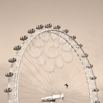 london eye in the spring sky and white clouds