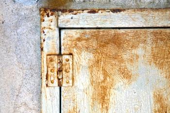abstract  steel  padock zip in a   closed rusty metal pattern door   varese italy sumirago
