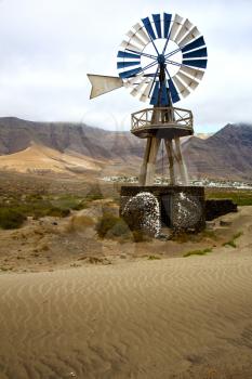 house in  isle of lanzarote  spain africa windmills and the sky 
