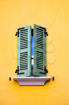 abbiate varese italy abstract  window   green in the yellow wall