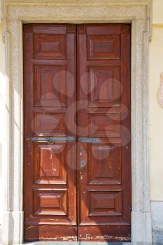abstract   santo macario rusty brass brown knocker in a  door curch  closed wood lombardy italy  varese
