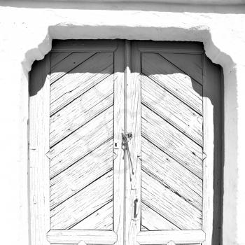 blue door      in antique village santorini greece europe and white wall