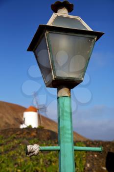 windmills spain street lamp a bulb in the blue sky wall arrecife teguise lanzarote 