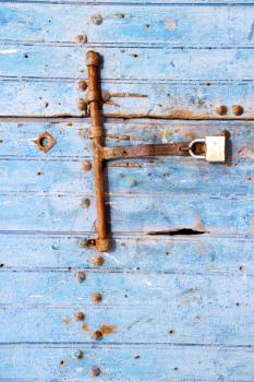 morocco in africa the old wood  facade home and rusty safe padlock 