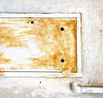 
abstract  steel  padock zip in a   closed rusty metal pattern door   varese italy sumirago