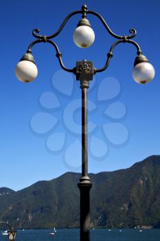 street lamp a bulb in the   sky lake of lugano Switzerland Swiss
