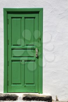spain  piece of colorated green wood as a window door in lanzarote 
