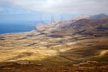 
lanzarote view from the top in  spain africa and house field coastline
