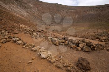 stone in los volcanes lanzarote  spain volcanic timanfaya  rock  sky  hill and summer 
