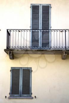 shutter europe  italy  lombardy        in  the milano old   window closed brick      abstract grate  