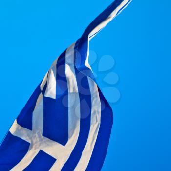 waving greece flag  in the blue sky and      flagpole