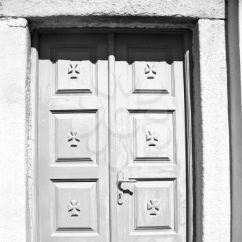   door      in antique village santorini greece europe   and white wall