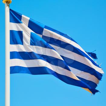 waving greece flag  in the blue sky and      flagpole