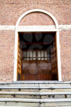  italy  lombardy     in  the cardano al campo old   church  closed brick tower     wall