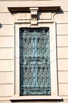 shutter europe  italy  lombardy       in  the milano old   window closed brick      abstract grate