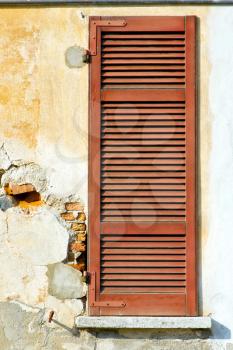 red window  varano borghi palaces italy   abstract  sunny day    wood venetian blind in the concrete  brick  
