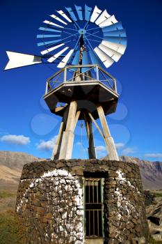 in  isle of lanzarote  spain africa windmills and the sky 
