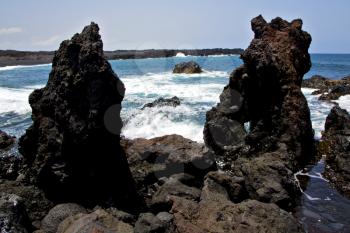 rock spain  sky light  beach water  in lanzarote  isle foam  landscape  stone  cloud   
