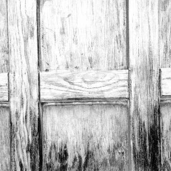 abstract texture of a brown antique wooden   old door in italy     europe