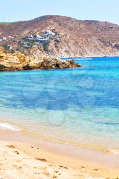 in      greece  the mykonos island rock sea and beach    sky