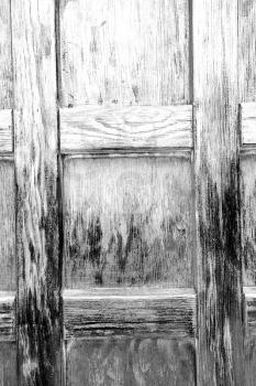 abstract texture of a brown antique wooden   old door in italy     europe
