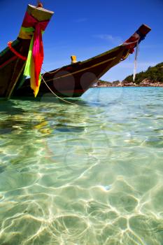 asia in the  kho tao bay isle white  beach    rocks house boat   thailand  and south china sea anchor
