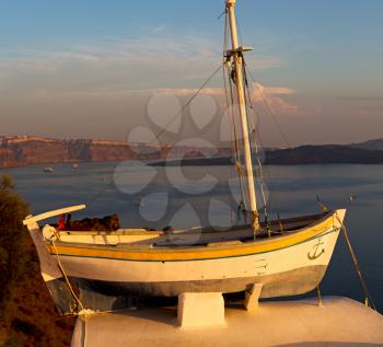 sailing in europe greece santorini island hill  and rocks on the summertime beach sunset boat