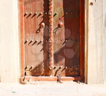   oman old wooden  door and wall in the house