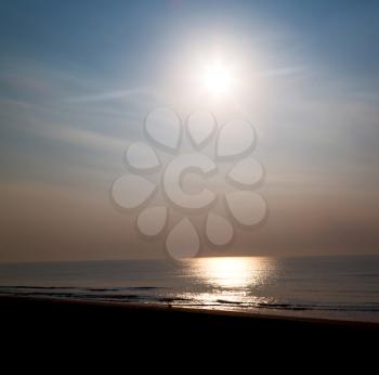  the blurred  sun falling down arabian sea ocean  in  oman coastline