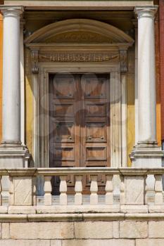 door   in italy  lombardy   column  the milano old   church   closed brick  pavement