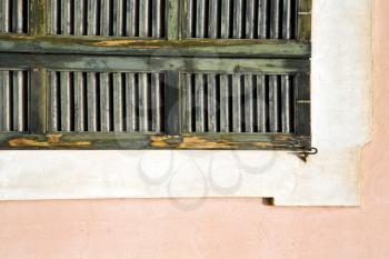 window  varese palaces italy   abstract  sunny day    wood venetian blind in the concrete  brick
