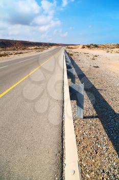 in oman old asphalt road near the coastline 