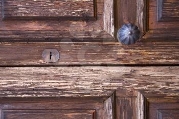 brass brown knocker and wood  glass door caronno varesino varese italy
