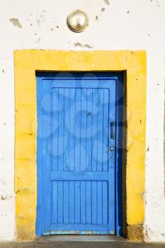 antique door in morocco africa blue wood and metal rusty