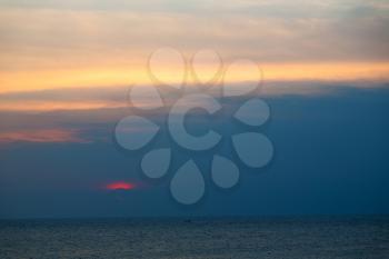  the blurred  sun falling down arabian sea ocean  in  oman coastline