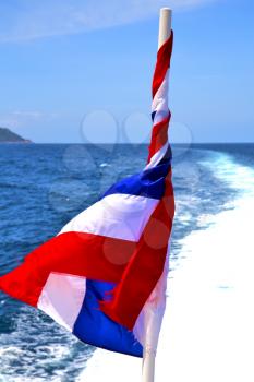asia  kho samu bay isle waving flag    in thailand and south china sea 