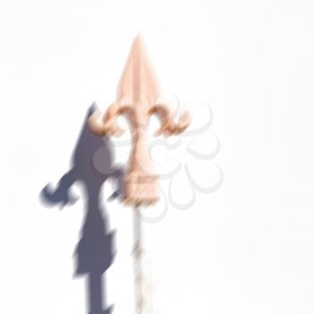 blurred in iran wall and shadow of a metal fence for the home  security like symbol