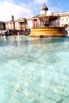 blurred  in london england trafalgar square and the old water  fountain 
