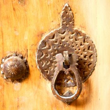 in iran antique door entrance and      decorative handle for background