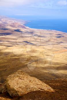 coastline lanzarote view from the top in  spain africa and house field 