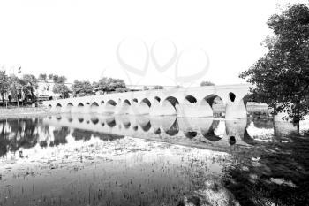 blu in iran  the old bridge and the river antique construction near nature