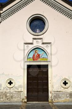  brass brown knocker and wood  door in a church abbiate varese italy