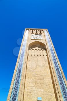 in iran old yazd city and the antique brick   clock  tower near the sky