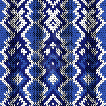 Knitted ornamental background in winter motif in cool blue hues and in white, seamless knitting vector pattern as a fabric texture