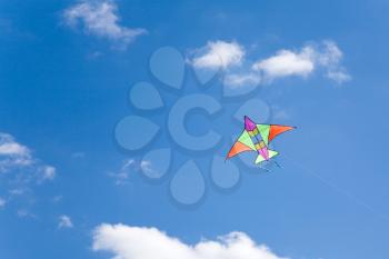 colorful kite flying in a blue sky