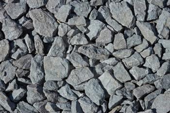 Many grayish scree stones as a background