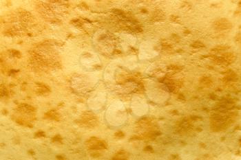 Surface of the corny pancake closeup as a texture