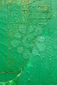 Detail of old wooden boards painted in green